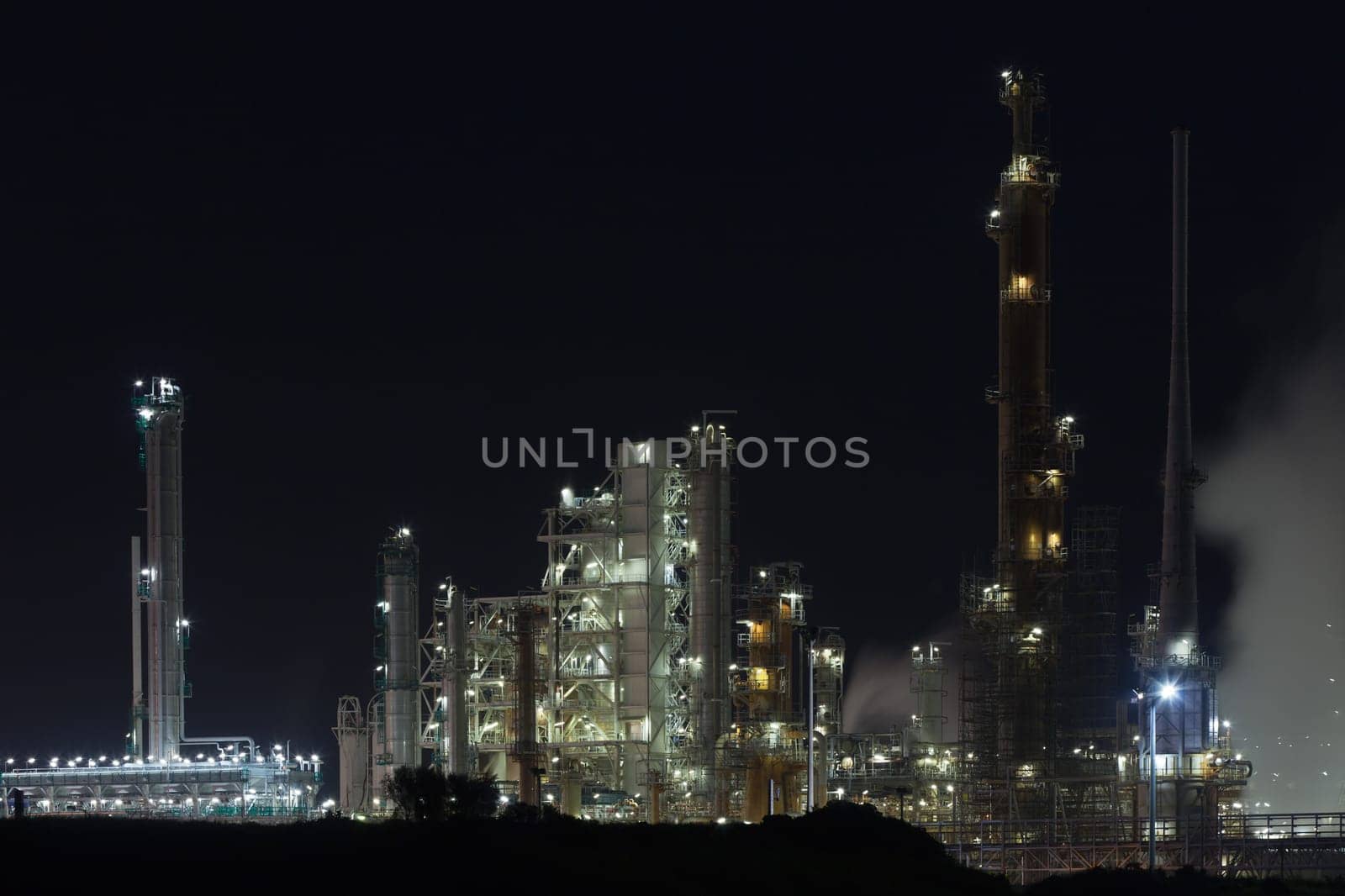 Night View of an Oil Refinery Plant. Horizontal shot