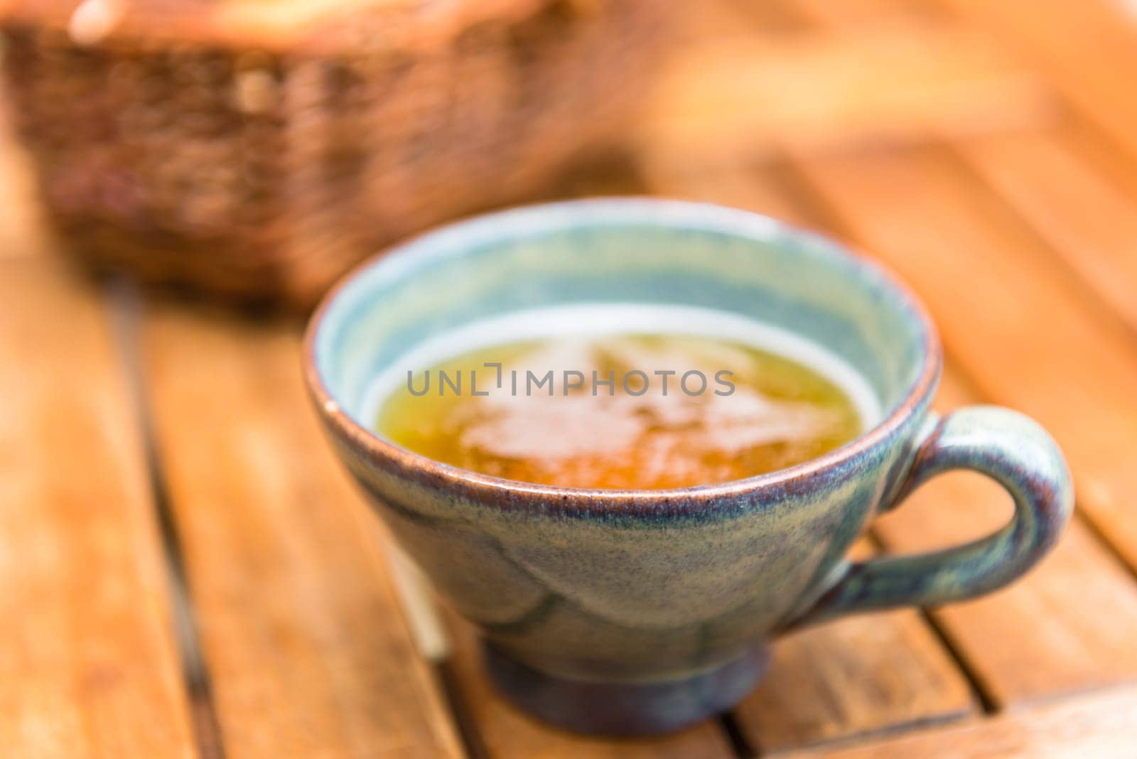 Norman apple cider in a typical ceramic cup. Shot with a selective focus