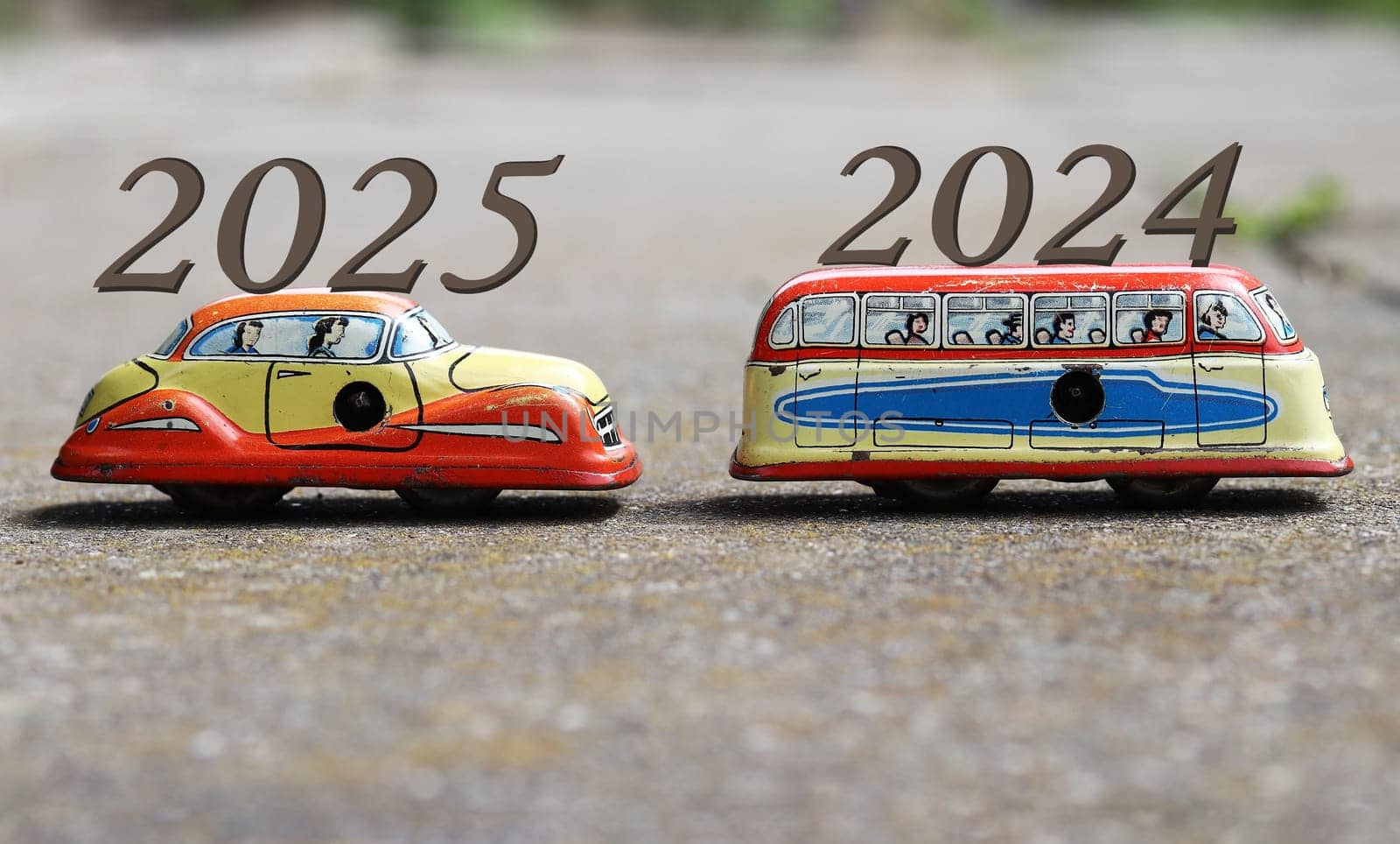 Turn of the year from 2024 to 2025 symbolically depicted with metal cars driving one behind the other