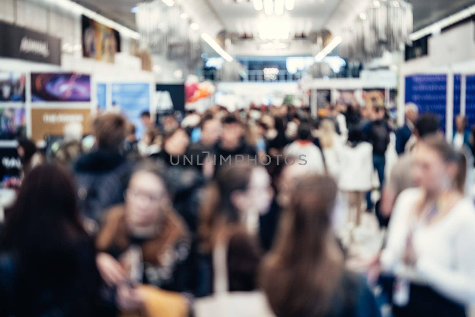 Abstract blurred people at exhibition hall of expo event trade show. Business convention show or job fair. Business concept background.