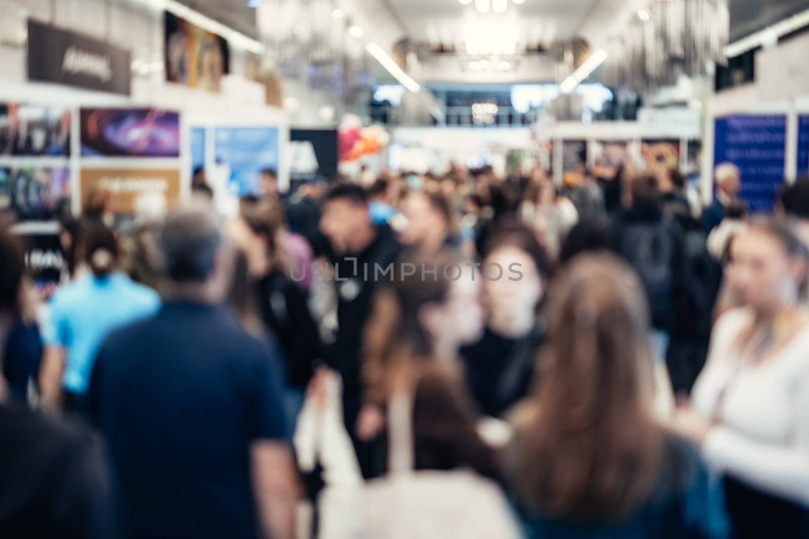 Abstract blurred people at exhibition hall of expo event trade show. Business convention show or job fair. Business concept background.