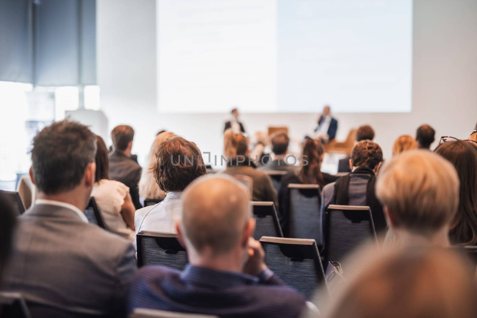 Interview and round table discussion at business convention and presentation. Audience at the conference hall. Business and entrepreneurship symposium.