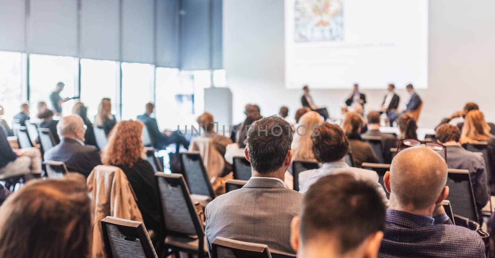 Interview and round table discussion at business convention and presentation. Audience at the conference hall. Business and entrepreneurship symposium.