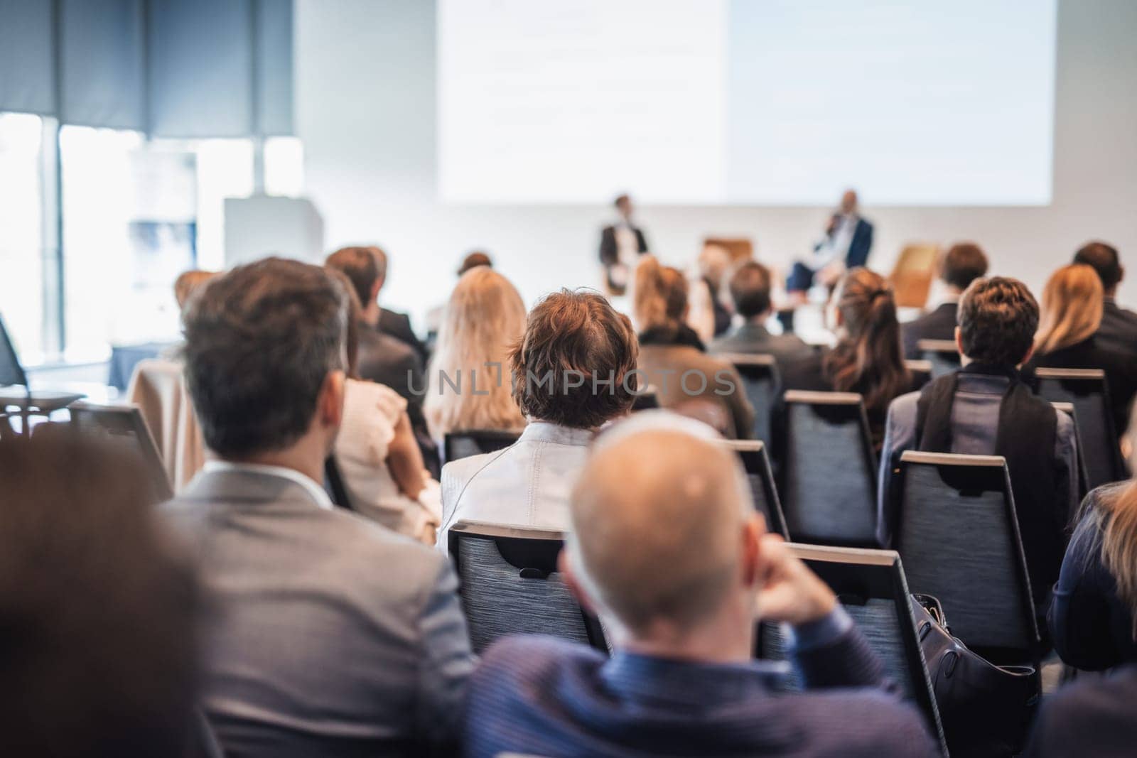 Interview and round table discussion at business convention and presentation. Audience at the conference hall. Business and entrepreneurship symposium.