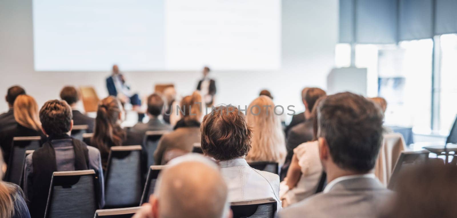 Interview and round table discussion at business convention and presentation. Audience at the conference hall. Business and entrepreneurship symposium.