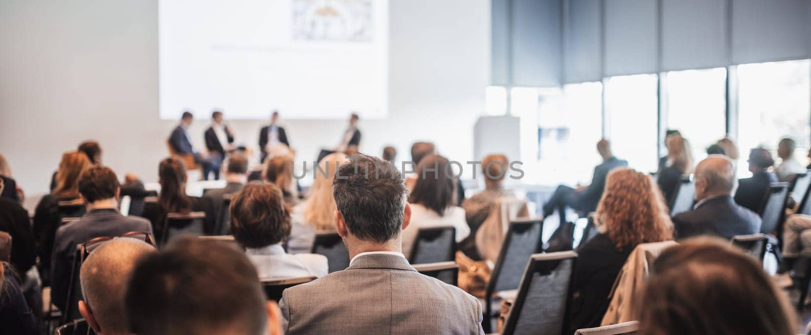 Interview and round table discussion at business convention and presentation. Audience at the conference hall. Business and entrepreneurship symposium.