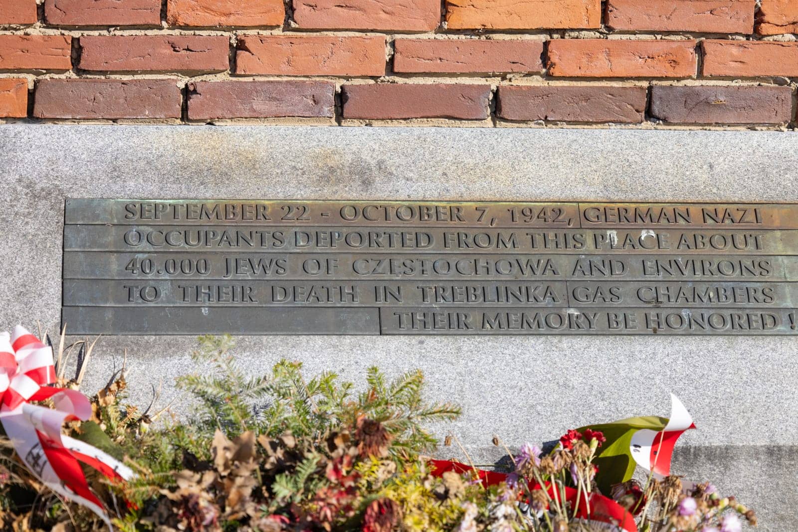 Czestochowa, Poland - October 18, 2024: Monument to Jews of Czestochowa, commemorates 40,000 Jews murdered in the Treblinka death camp. Star of David made of railway rails, crack in red brick wall