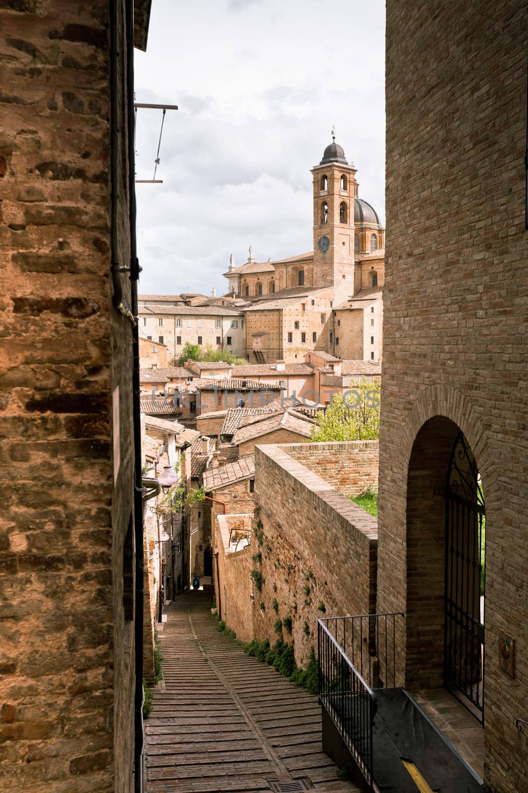 Old Urbino, Italy, cityscape at dull day. Vertical toned and vignetted image