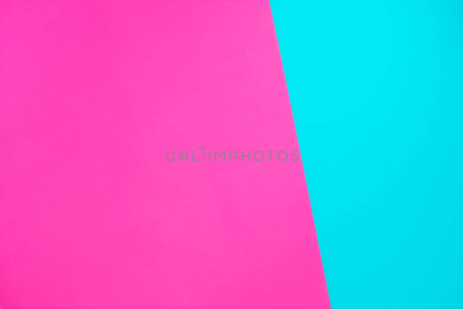 Blue and pink neon color paper geometric flat lay background texture