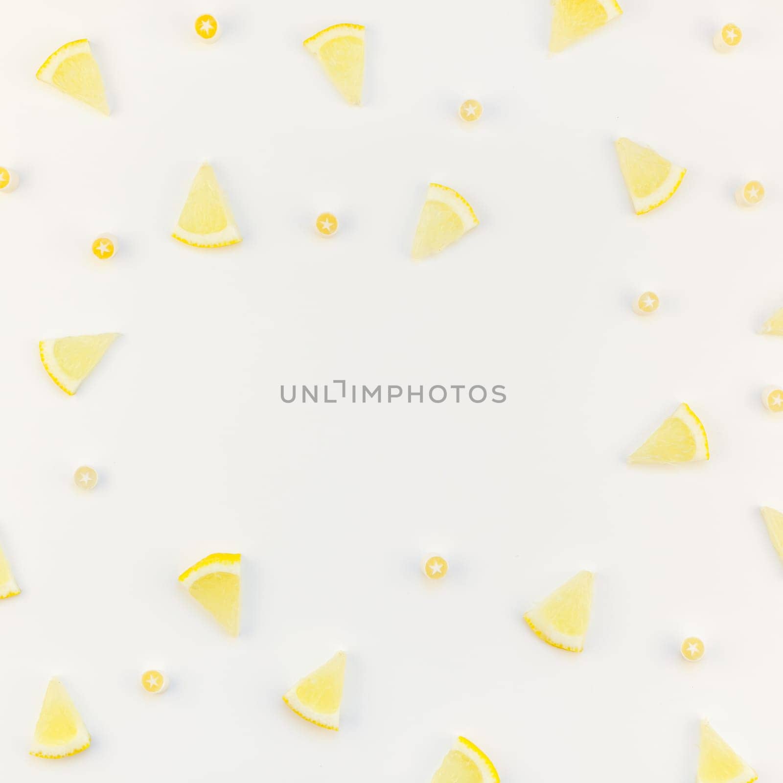 Square flatlay overhead top view citrus lemon slices pattern frame white table background with copyspace. Hot summer refreshment lemonade concept. Beverage ingredients arranged