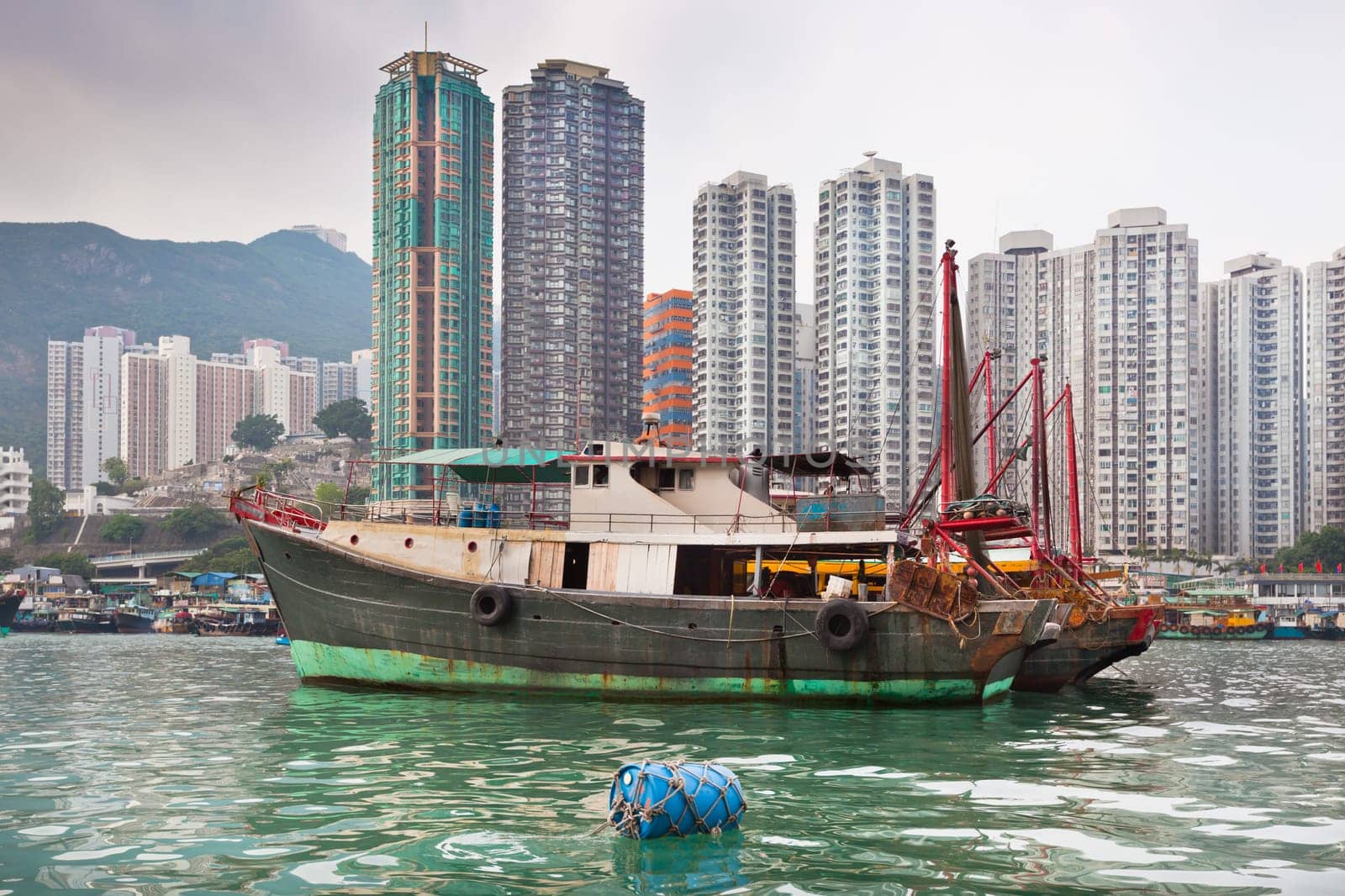 Traditional fishing trawlers in the Aberdeen bay, famous floating village in Hong Kong