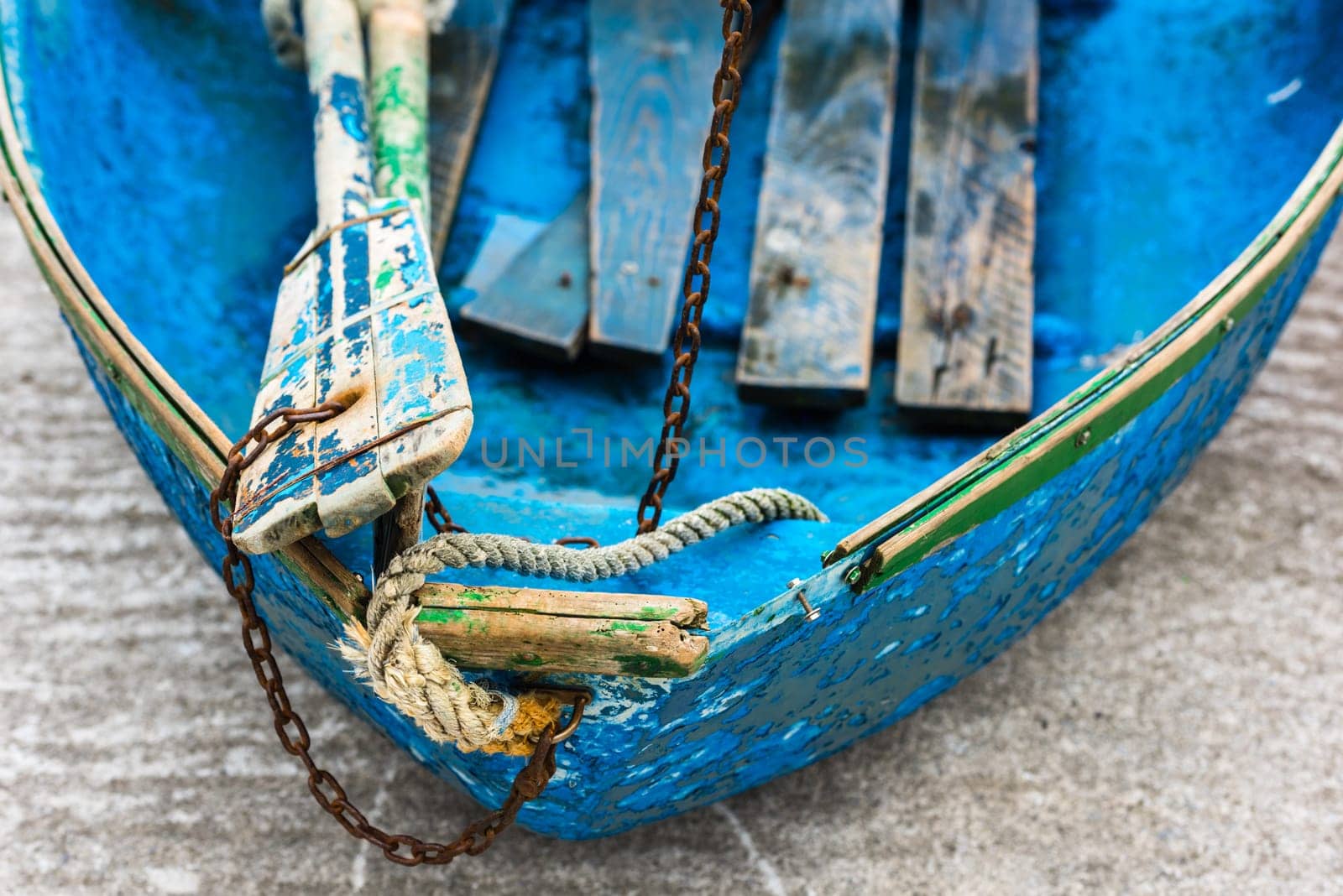 Old blue wooden shabby fishing boat detail. Shot with a selective focus