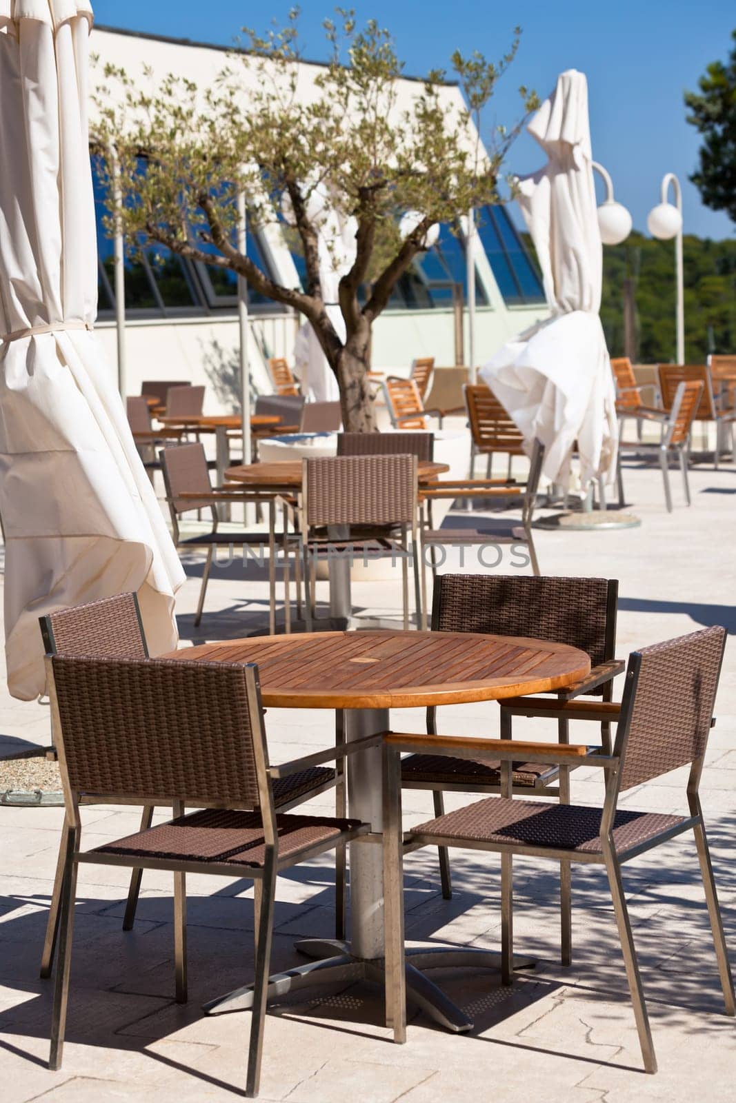 Summer outdoor cafe is empty in a hot midday