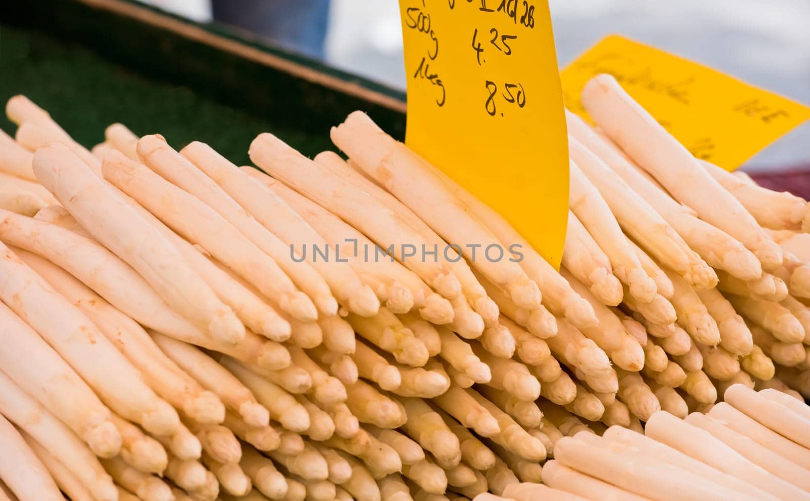 Fresh asparagus selling in a farmers market. Shot with a selective focus