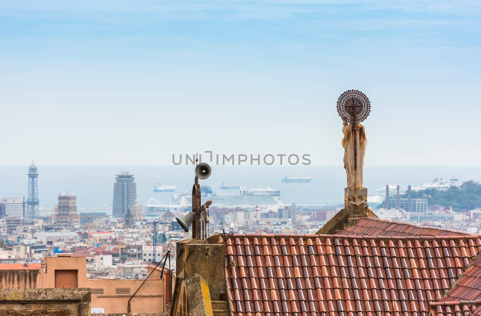 Buildings roofs in Barcelona, Spain. Cityscape and the sea as a background