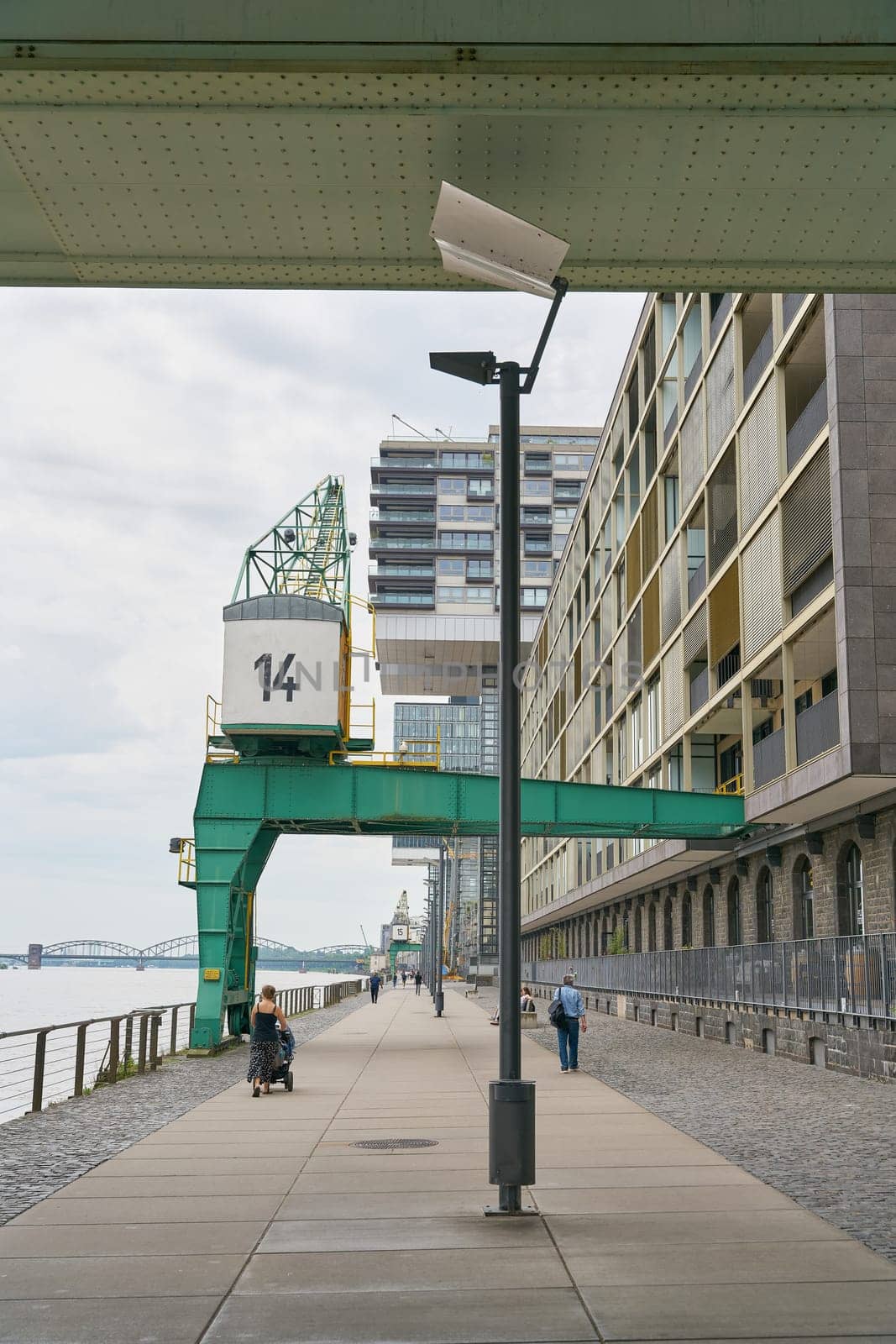 historic crane in the modern Rheinauhafen on the banks of the Rhine in Cologne
