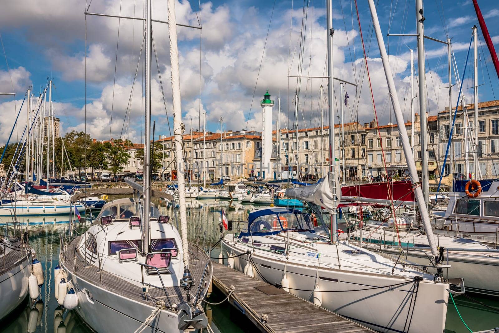 FRANCE, LA ROCHELLE - SEPTEMBER 21, 2015: View of yachts and a beautiful lighthouse in the old port of La Rochelle France