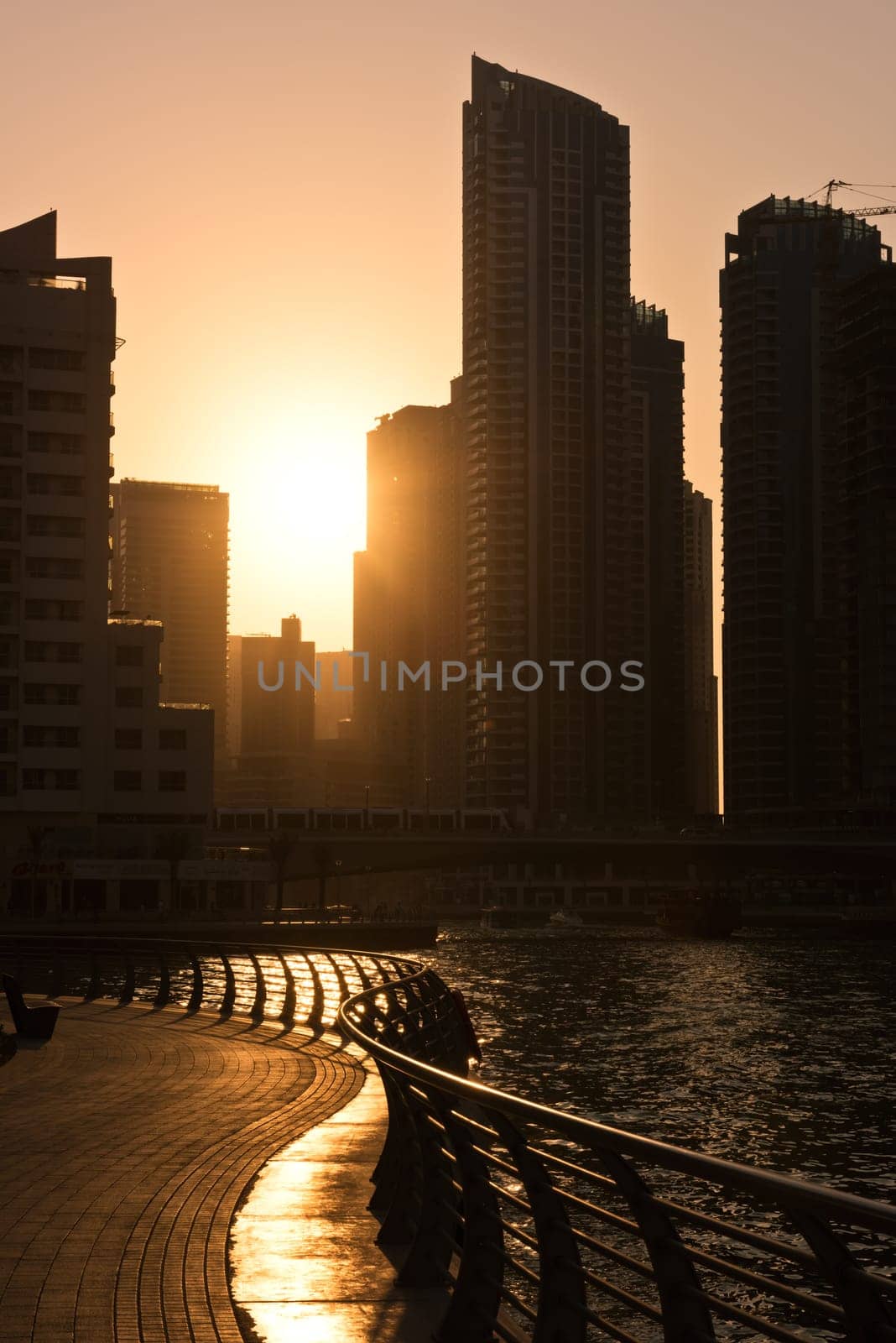 UAE, DUBAI - DECEMBER 31: Skyscrapers silhuette at sunset in Dubai marina on December 31, 2014. Contre jour shot
