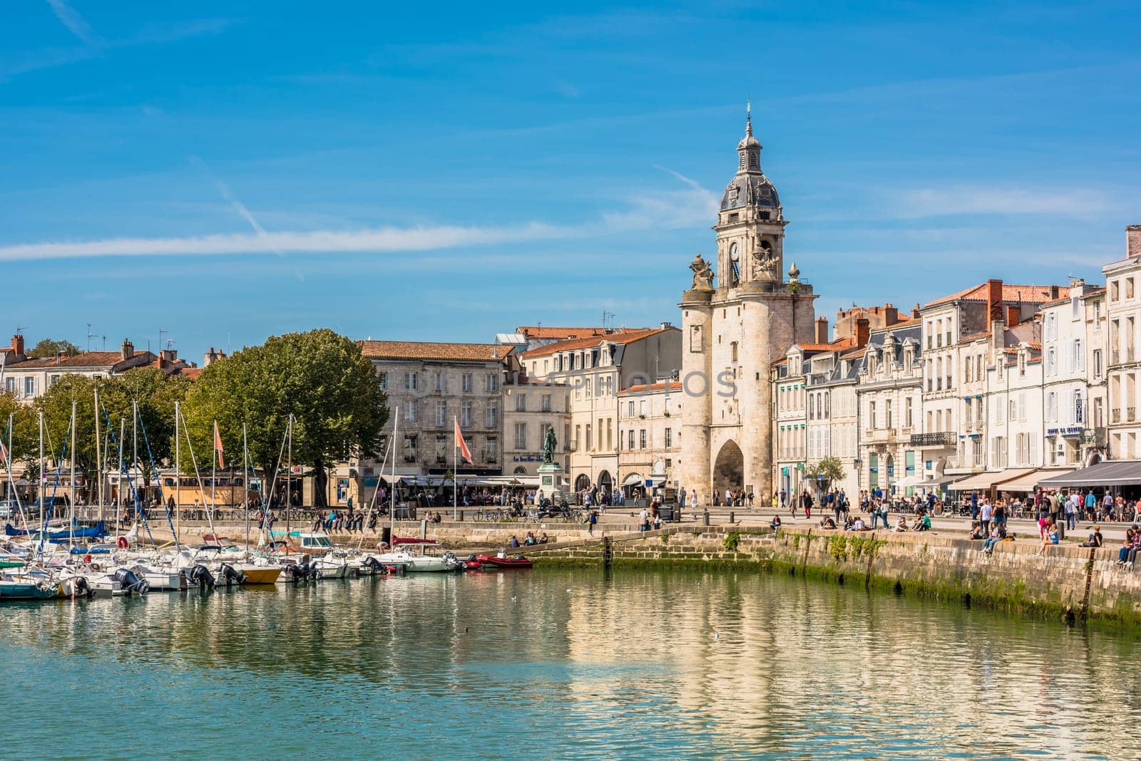 FRANCE, LA ROCHELLE - SEPTEMBER 21, 2015: View of people on the promenade in the old port of La Rochelle France