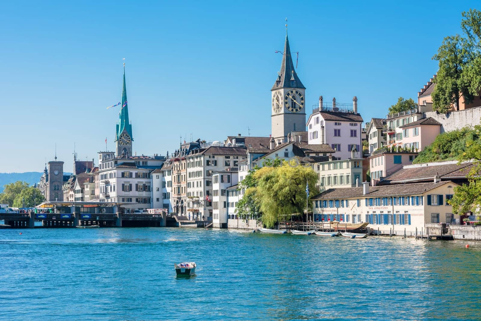 SWITZERLAND, ZURICH - AUGUST 22: view of historic Zurich city center with famous St. Peter and Fraumunster churches, Limmat river and Zurich lake on August 22, 2015