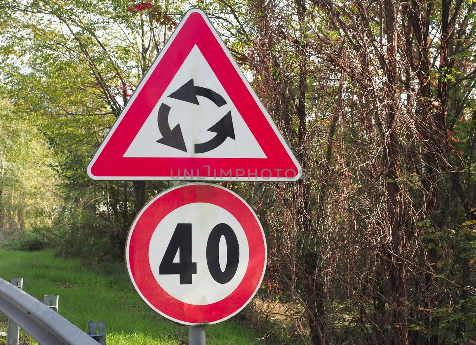 Warning signs, roundabout and speed limit traffic sign