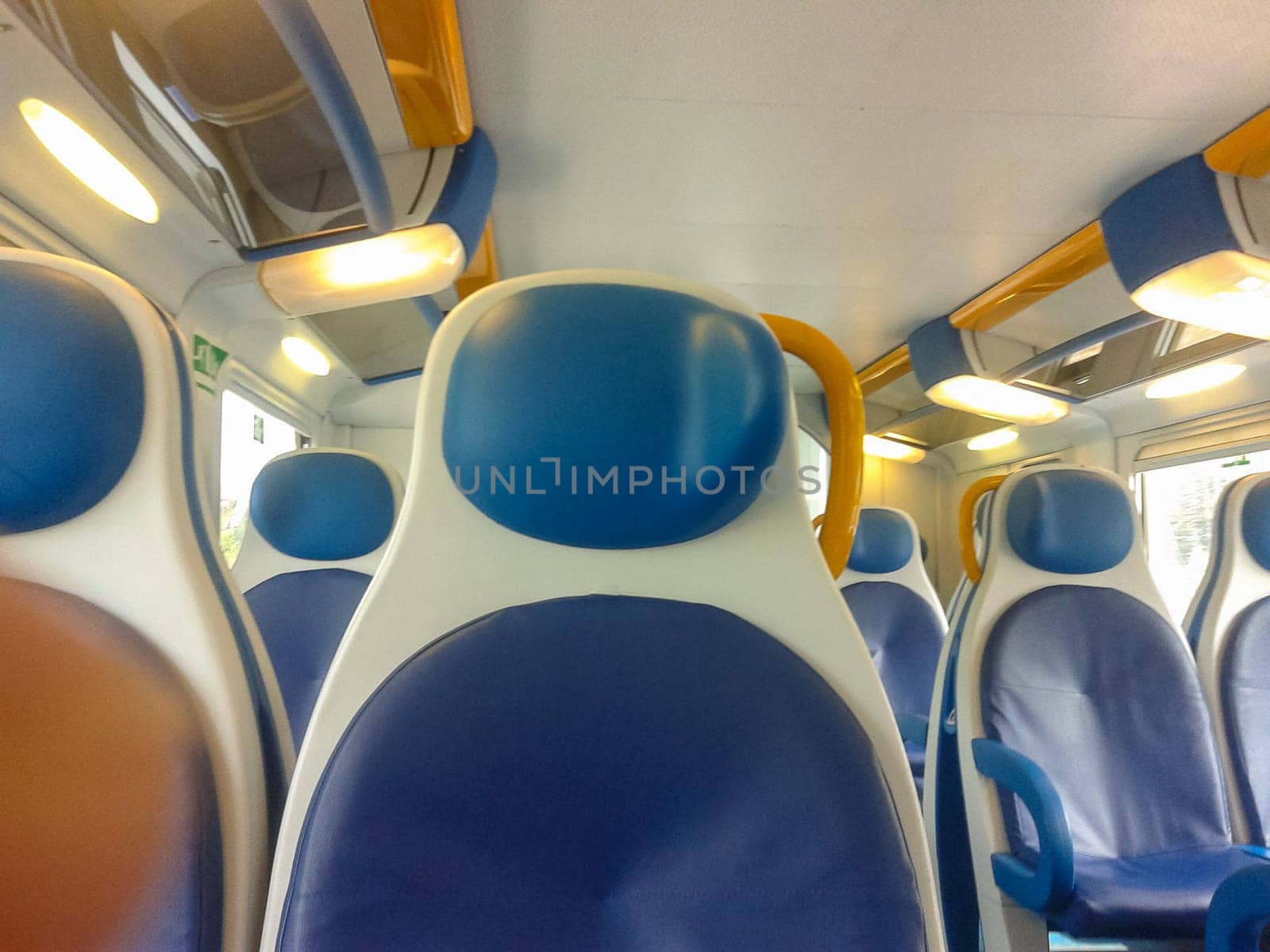 Interior view of a regional train empty seats