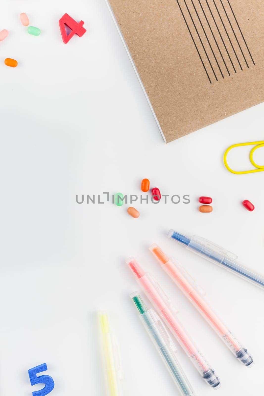 Creative flat lay back to school concept with color school and office supplies on white table background with copy space, frame, template for text or design