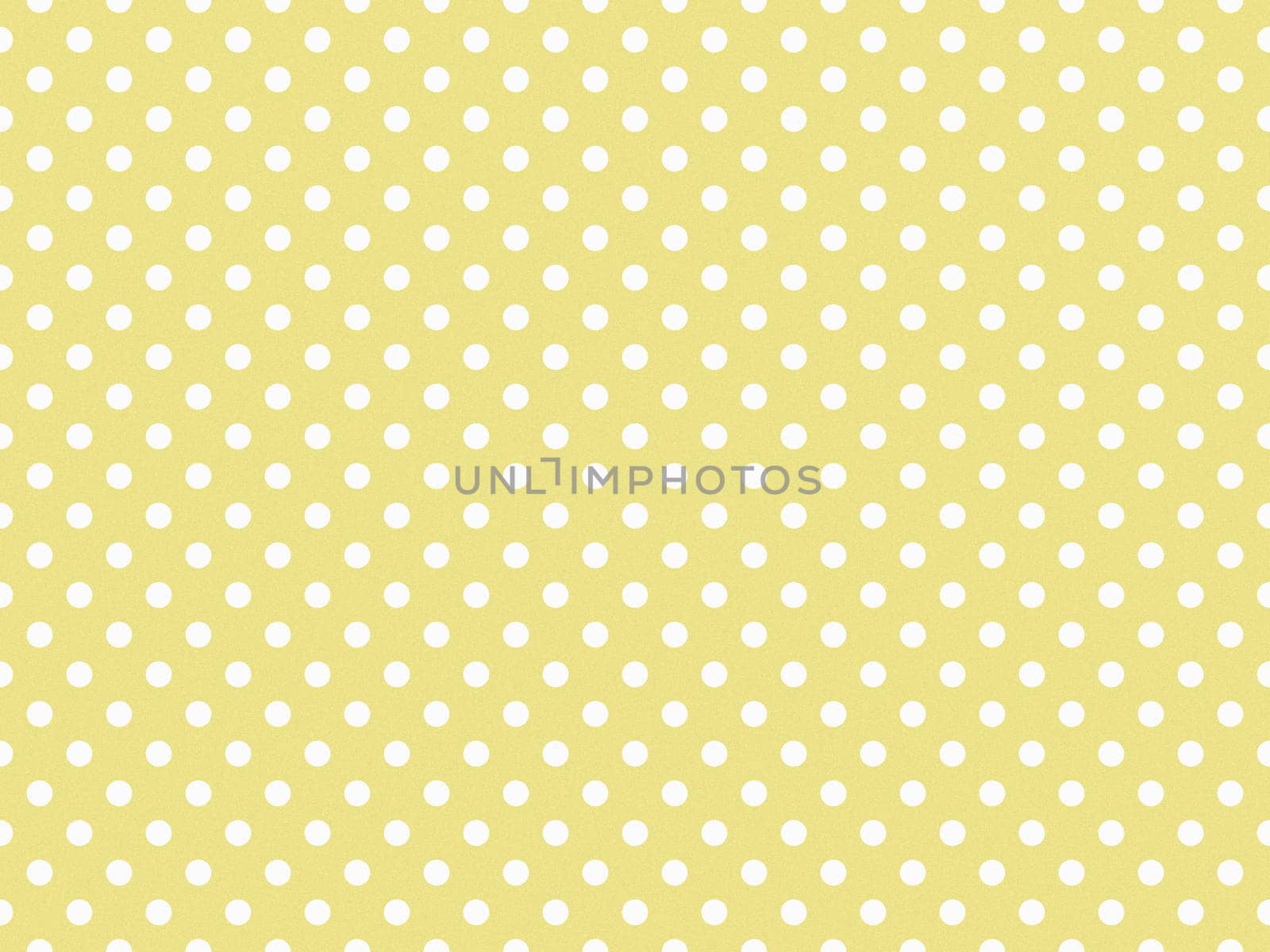 texturised white colour polka dots pattern over khaki yellow useful as a background