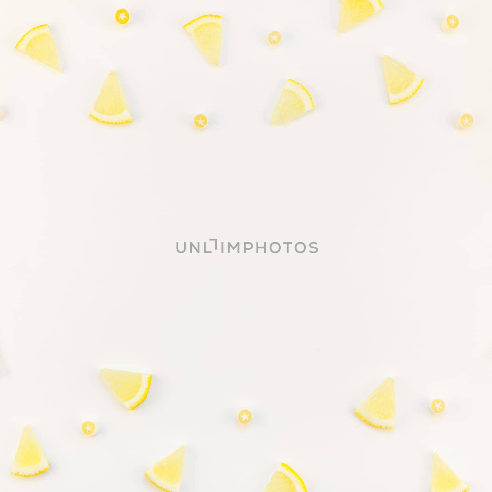 Square flatlay overhead top view citrus lemon slices pattern frame white table background with copyspace. Hot summer refreshment lemonade concept. Beverage ingredients arranged