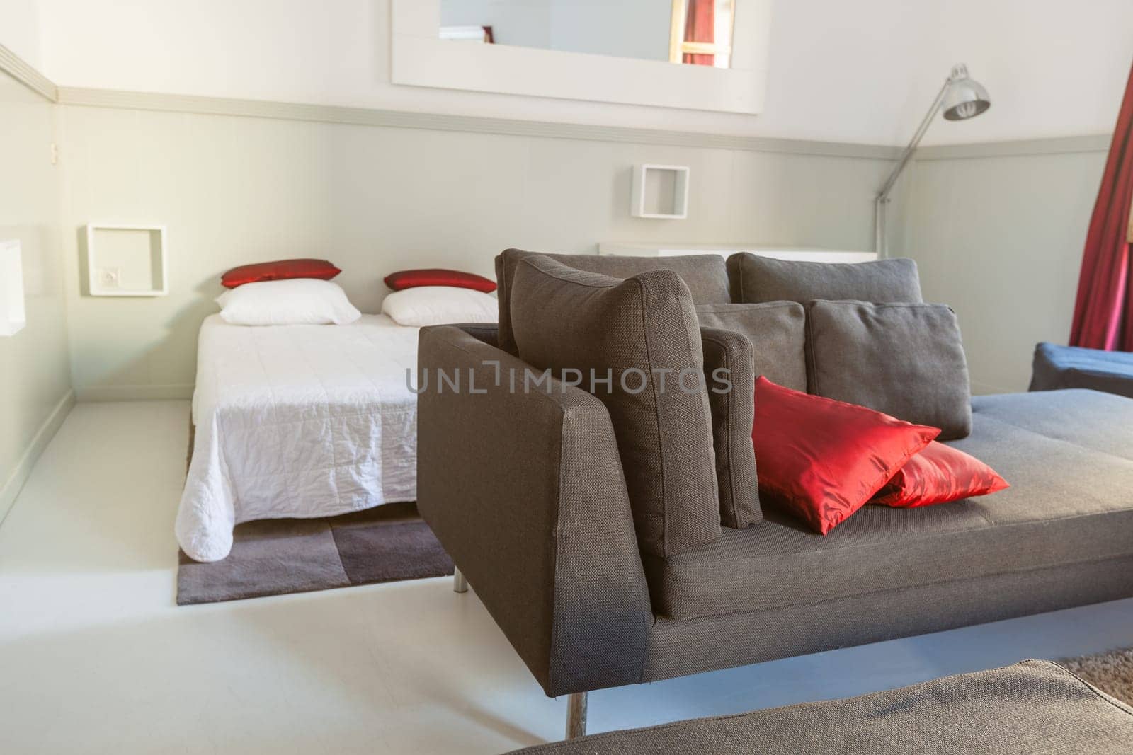 Modern apartments cozy furniture: a sofa with pillows