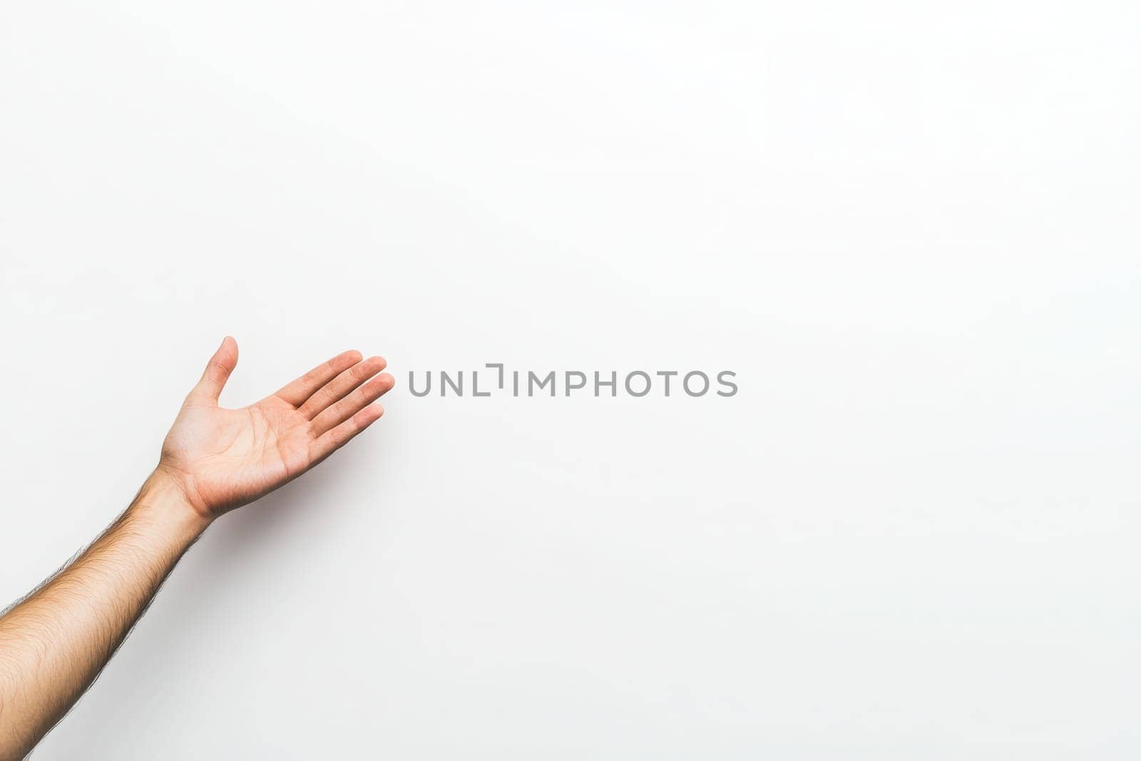 An open palm is presented in a welcoming gesture, with a focus on the hands details against a pristine white background, conveying openness and approachability.