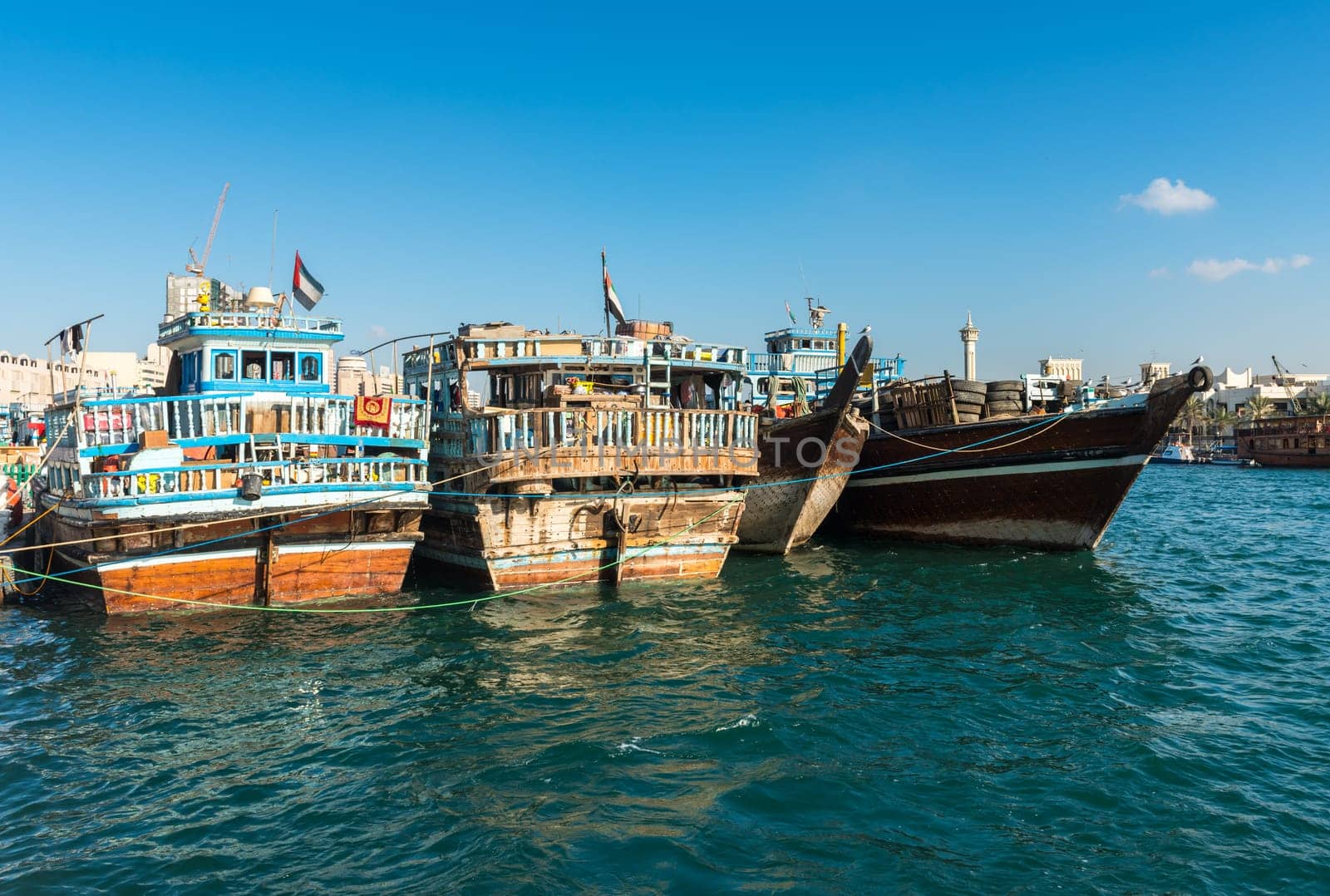UAE, DUBAI - DECEMBER 27: traditional arabic cargo boats at Dubai creek on December 27, 2014