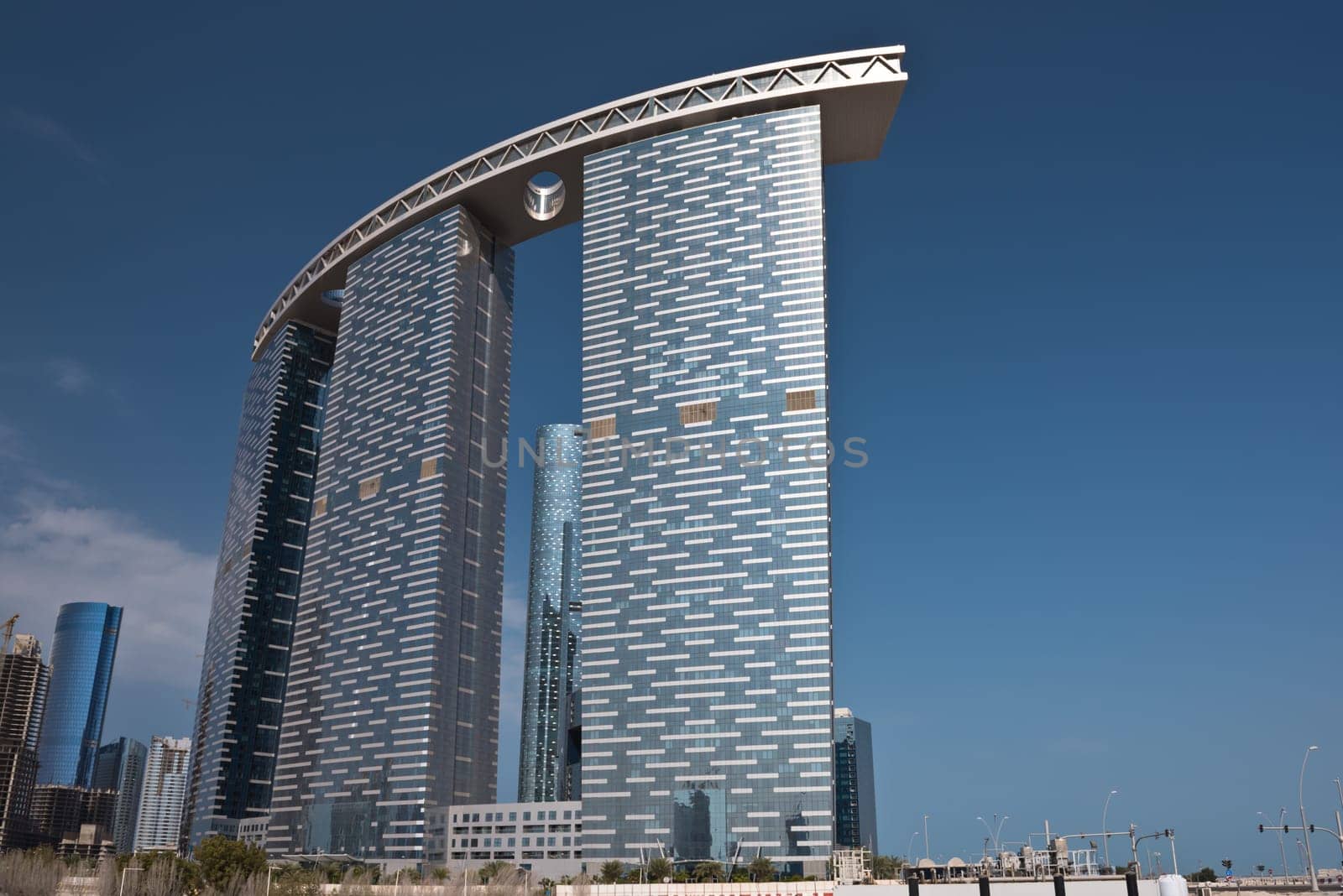 ABU DHABI, UAE - DECEMBER 24: Abu Dhabi streets with The Gate Towers skyscrapers on December 24, 2014. United Arab Emirates