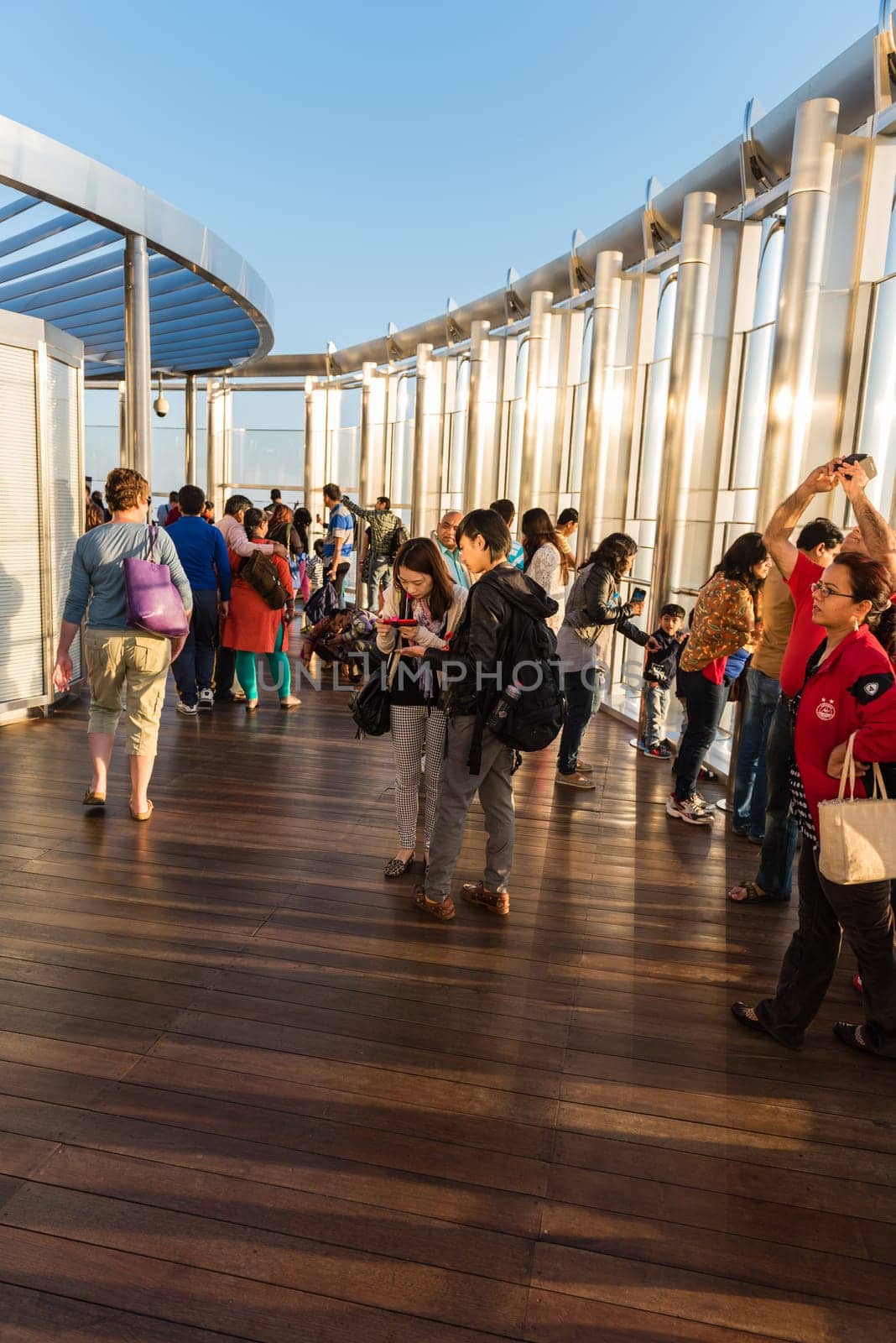 DUBAI, UAE - JANUARY 02: people at the top the observation deck of the highest building in the world Burj al Khalifa on January 02, 2015 in Dubai, United Arab Emirates