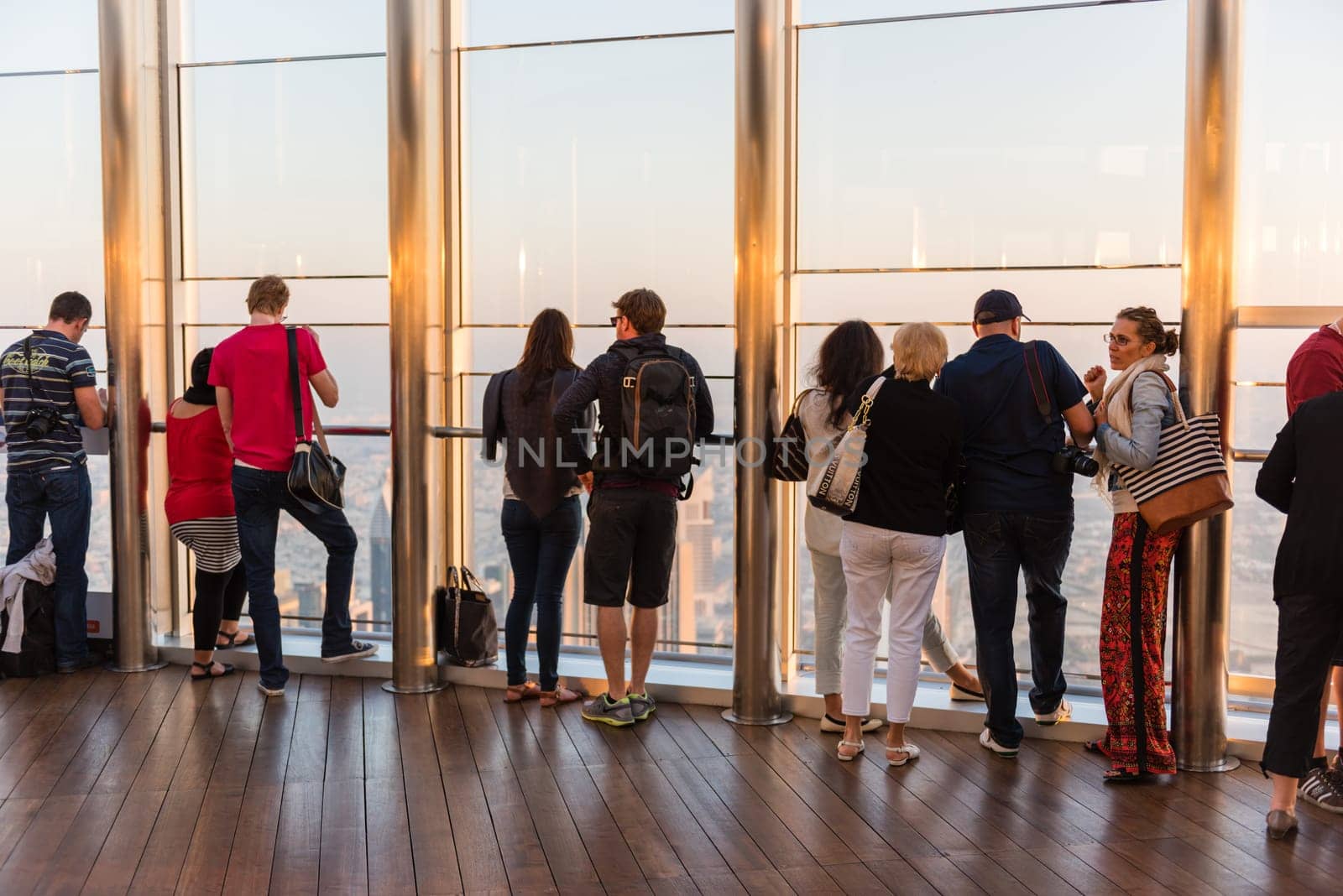 DUBAI, UAE - JANUARY 02: people at the top the observation deck of the highest building in the world Burj al Khalifa on January 02, 2015 in Dubai, United Arab Emirates