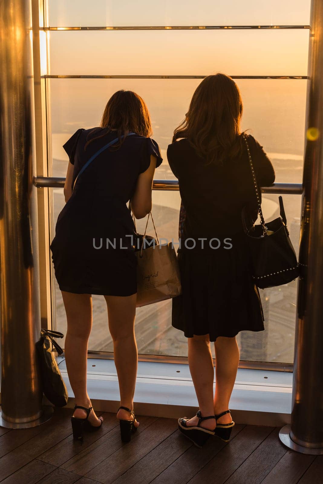 DUBAI, UAE - JANUARY 02: people at the top the observation deck of the highest building in the world Burj al Khalifa on January 02, 2015 in Dubai, United Arab Emirates