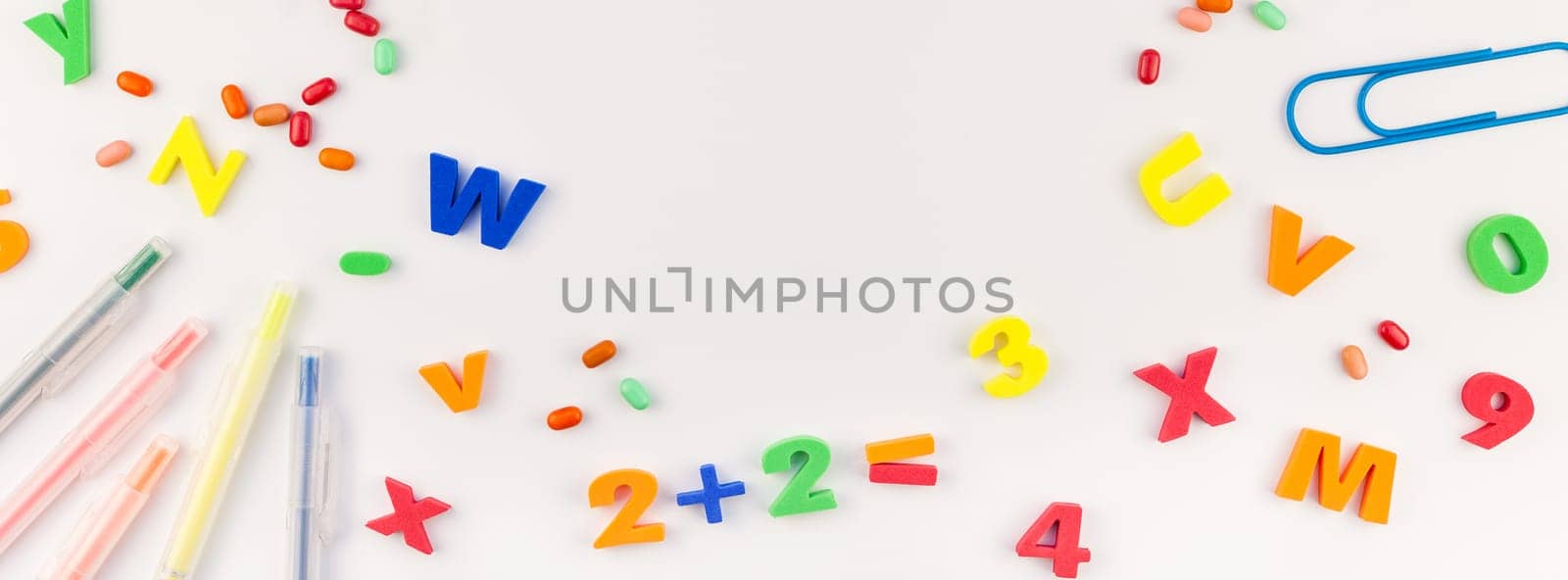 Long wide banner back to school concept with color school and office supplies on white table background with copy space, frame, template for text or design