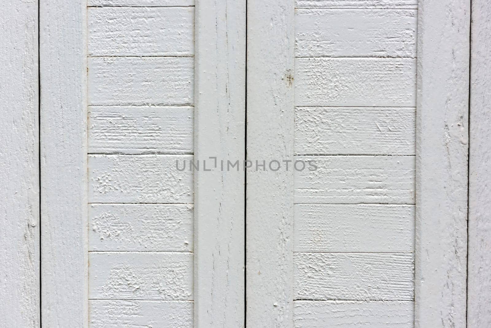 window with closed beige wooden shutters. background photo