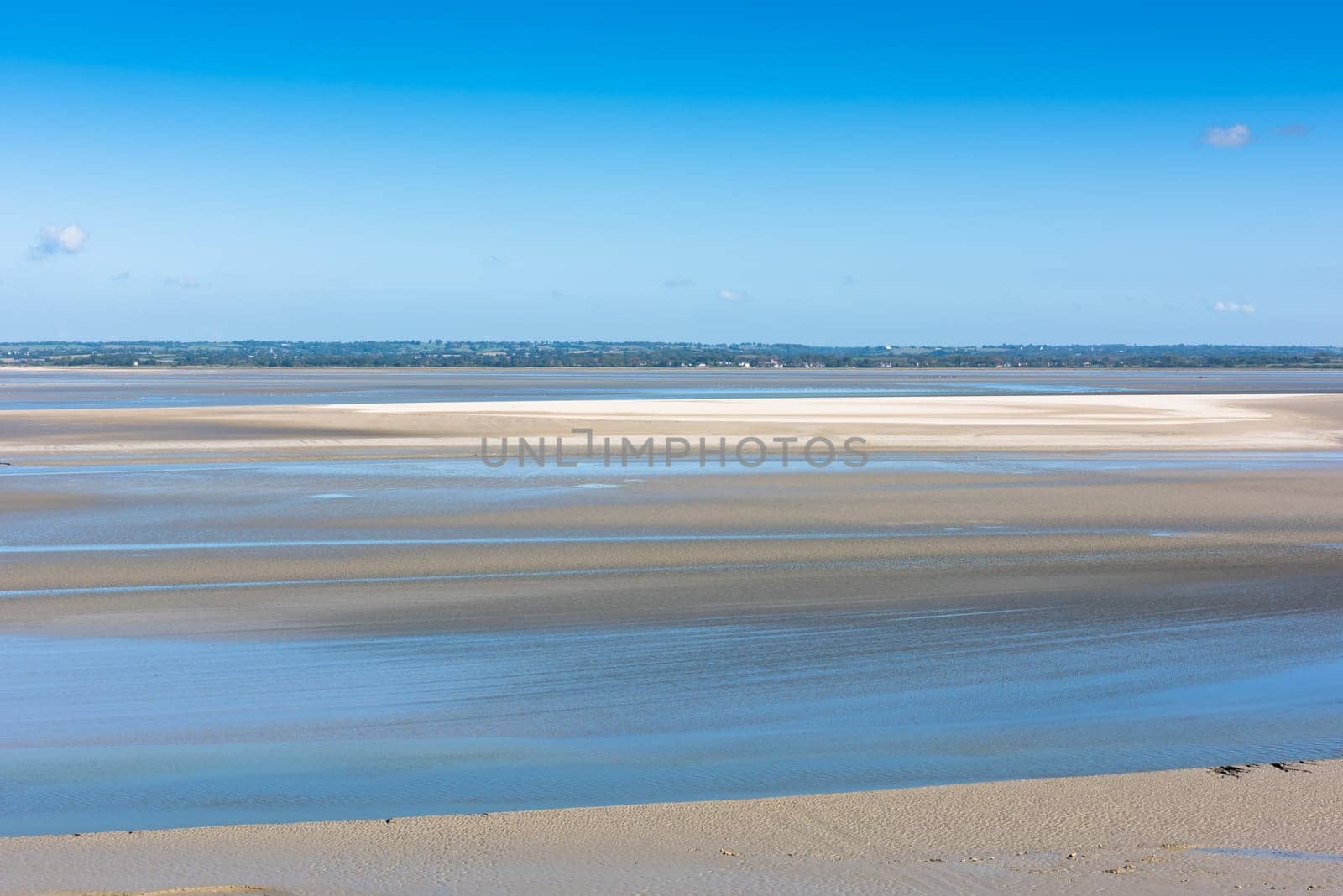 View from walls of Mont Saint Michel on the bay during the low tide. France