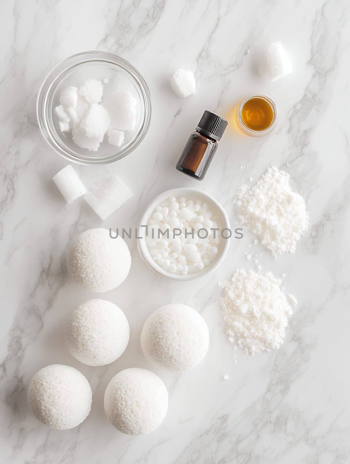 Ingredients for homemade bath bombs on a marble surface, showcasing DIY beauty and self-care.