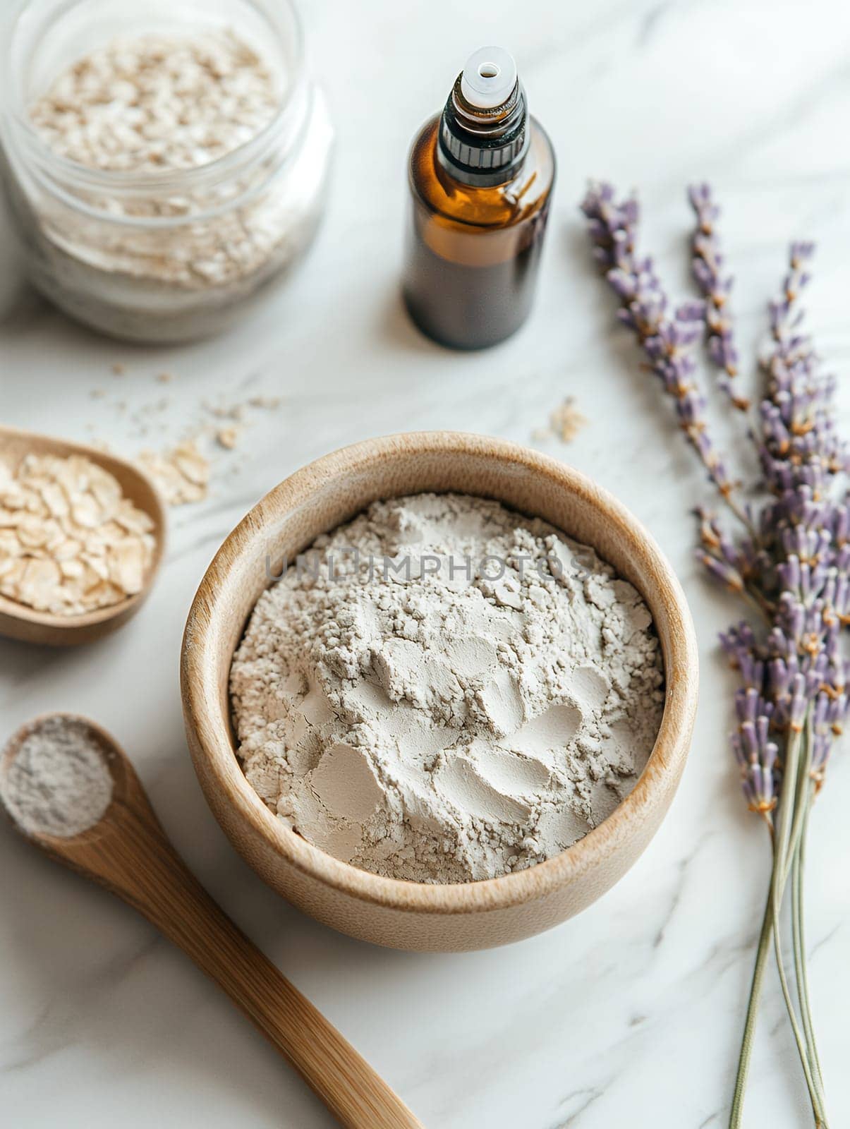 Flat lay of natural skincare ingredients including clay, oats, and lavender, ideal for organic beauty concepts.