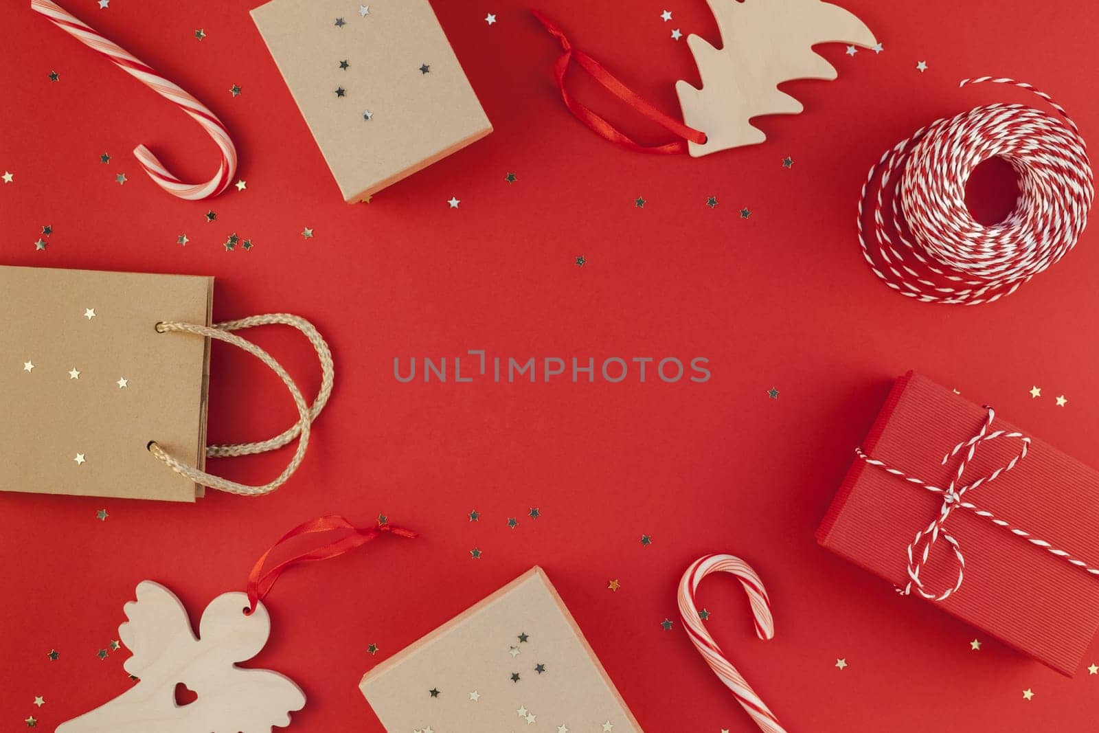 New Year Christmas presents wrapped ribbon flat lay top view Xmas holiday 2019 celebration handmade gift boxes red paper golden sparkles background copyspace. Template mockup greeting card text design