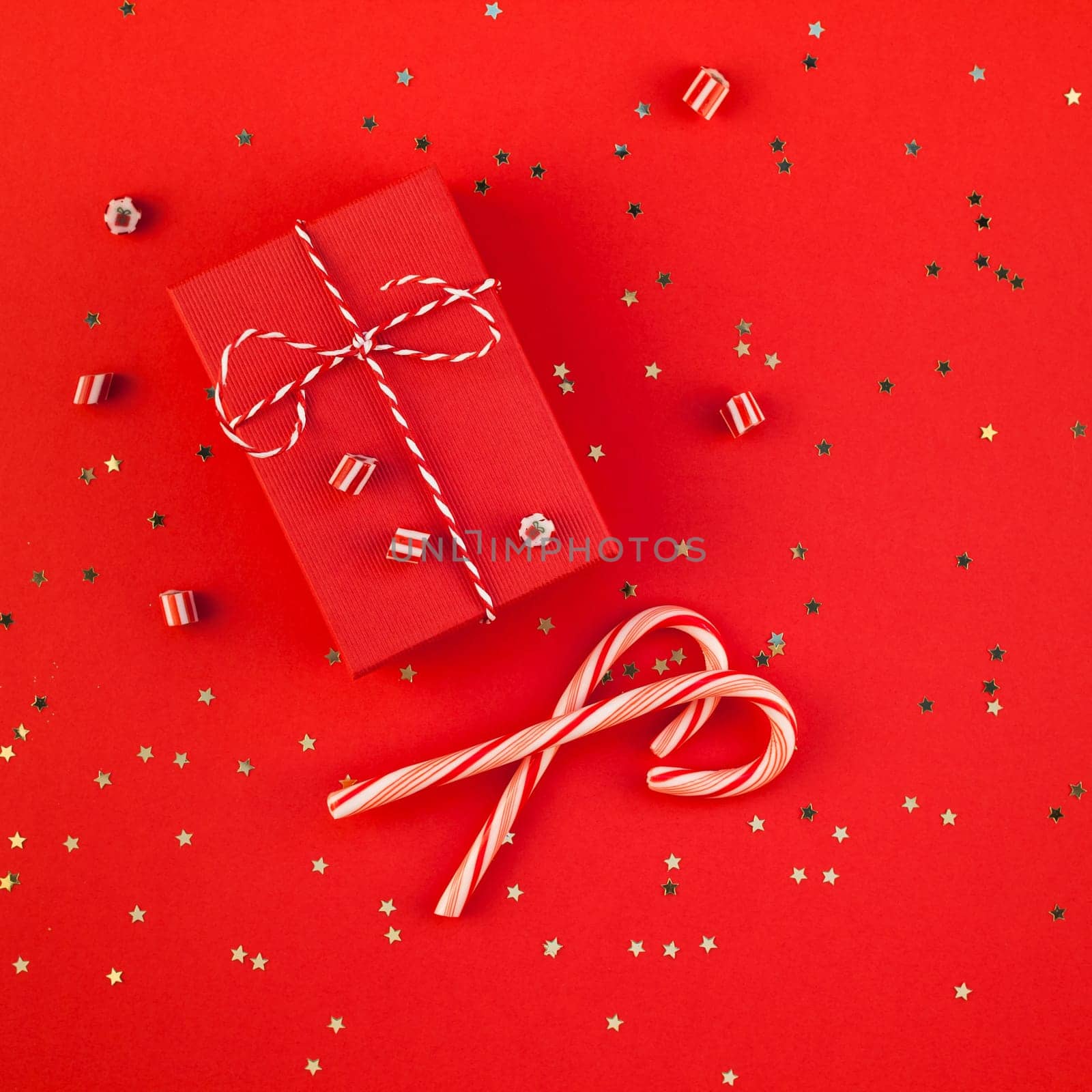 New Year or Christmas presents wrapped ribbon flat lay top view Xmas holiday 2019 celebration handmade gift boxes red paper golden sparkles background. Square Template mockup greeting card text design
