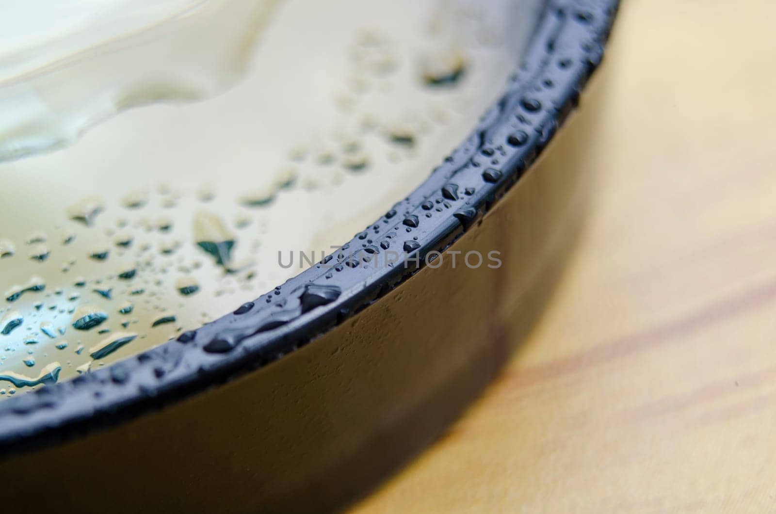 Close up of wet magnifying glass with customizable space for text or ideas.