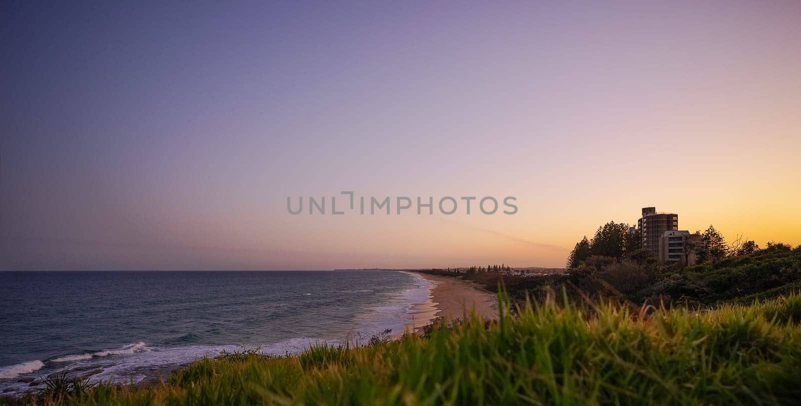 A panoramic view of the Sunshine Coast beachfront from Point Cartwright Buddina south to Caloundra at sunset