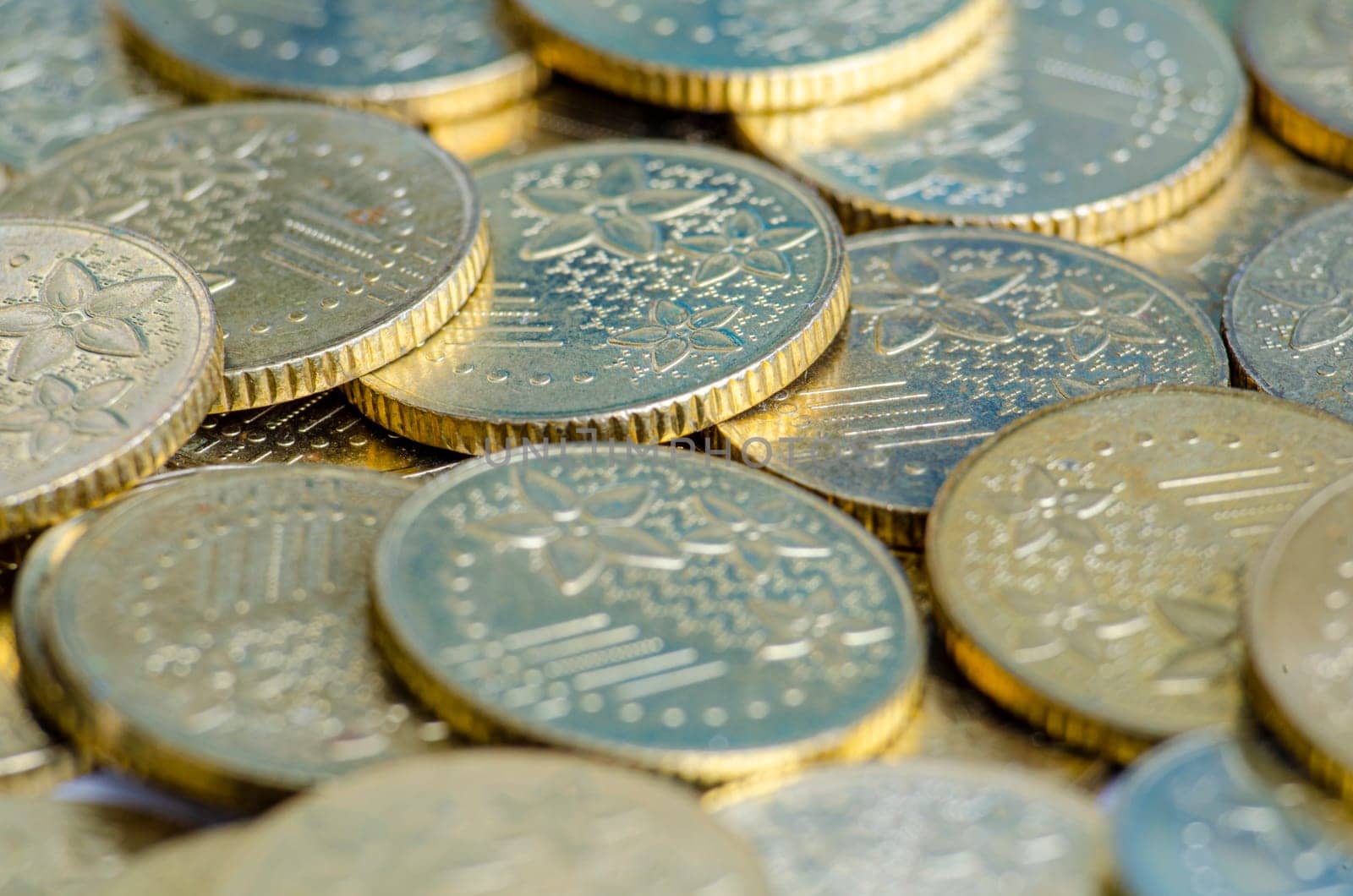 Close up view of golden coins representing business, investment or any monetary concept.