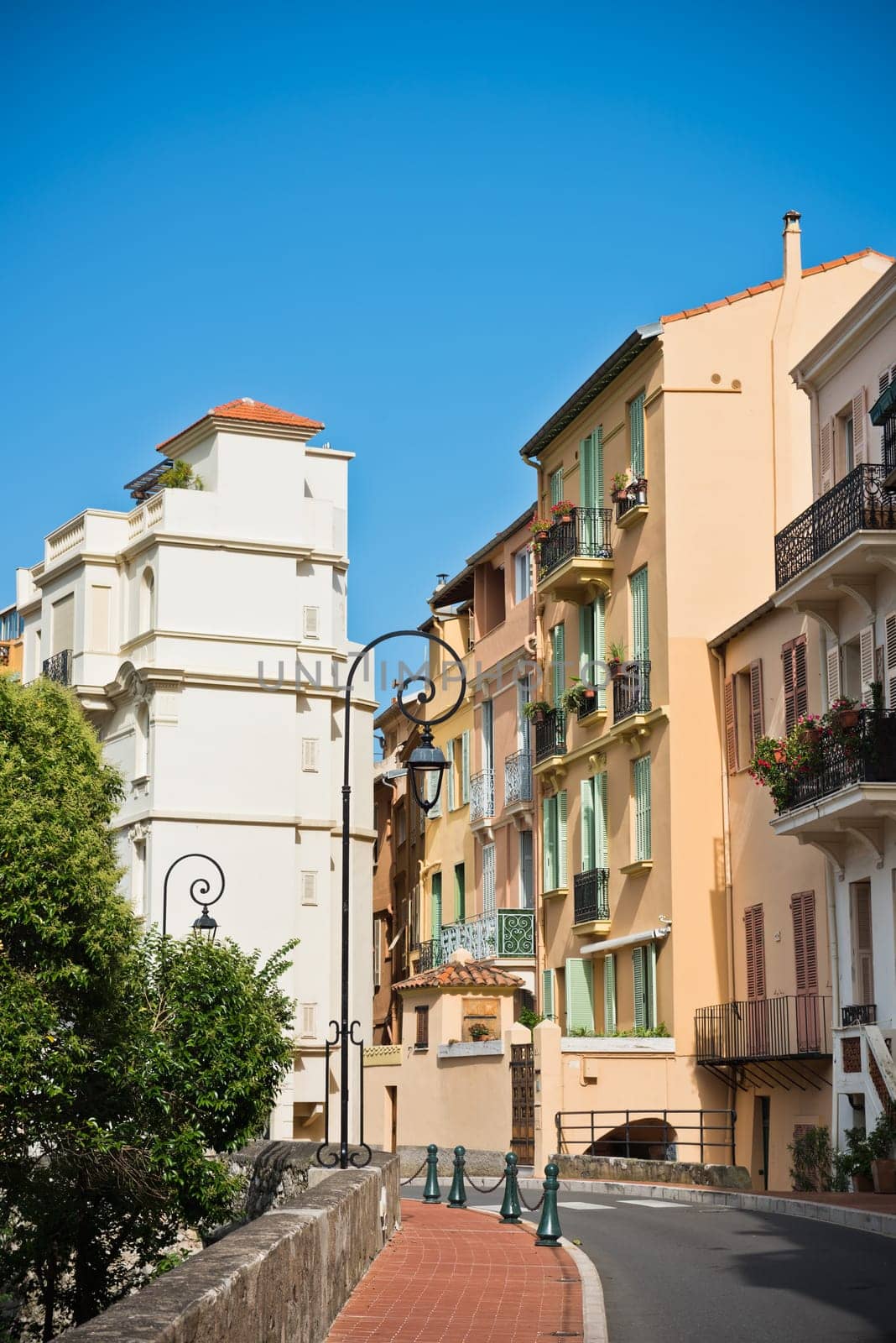 Streets and buildings in old town Monaco. Vertical shot