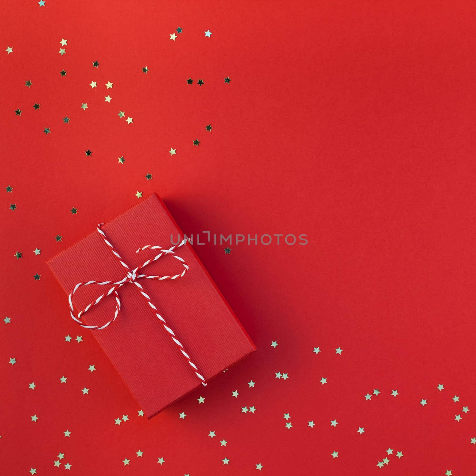New Year Christmas presents ribbon flat lay top view Xmas 2019 holiday celebration handmade gift box red paper golden sparkles background copyspace. Square Template mockup greeting card text design