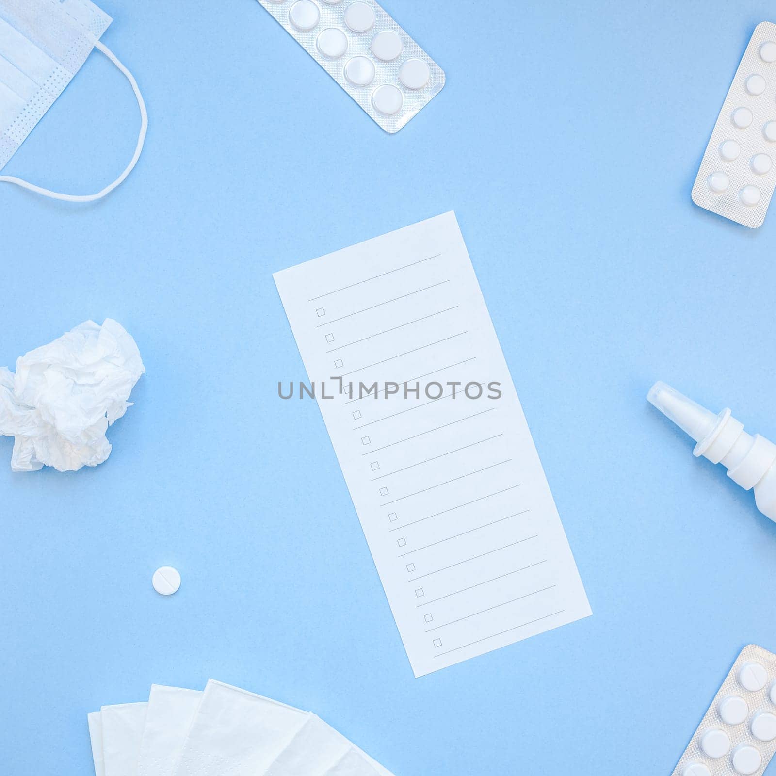 Creative flat lay concept of seasonal spring allergy with napkins, pills, face mask and drops in a bottle with copy space square background minimal style, template for text