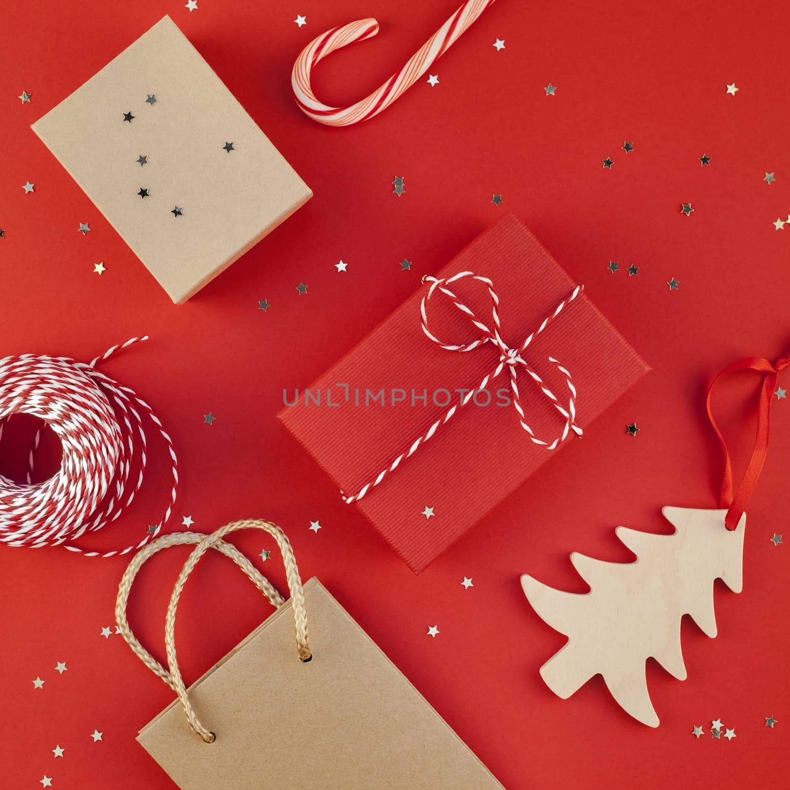 New Year Christmas presents ribbon flat lay top view Xmas holiday 2019 celebration handmade gift boxes red paper golden sparkles background copyspace. Square Template mockup greeting card text design